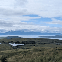 hillside moorland with loch in background