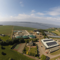 Birds eye view of Peacehill Farm, farmland and river in background