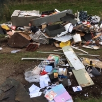 Large pile of flytipped rubbish on private land
