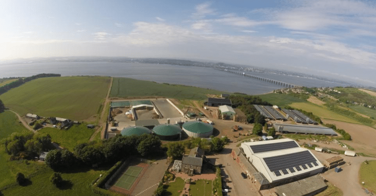 Birds eye view of Peacehill Farm, farmland and river in background