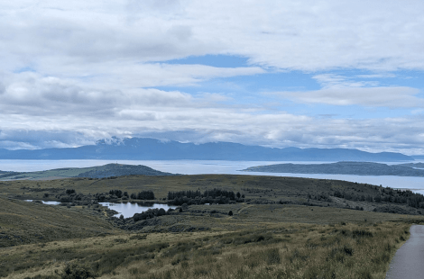 hillside moorland with loch in background