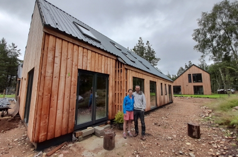 People standing in front of house