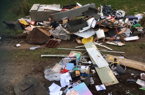 Large pile of flytipped rubbish on private land