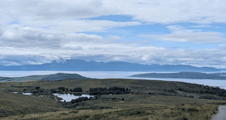 hillside moorland with loch in background